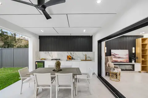 Dining area opening to the covered alfresco and backyard – knockdown rebuild at 28 Aylesbury Crescent, Chipping Norton