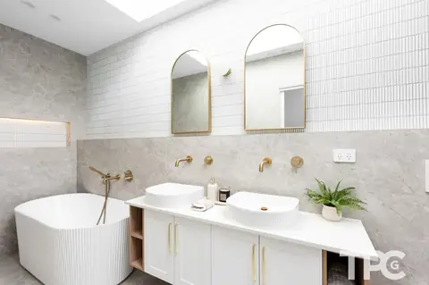 Bathroom with freestanding bath, double basins and arched mirrors – knockdown rebuild at 146 Wattle Road, Sutherland