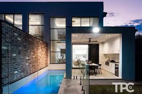 Rear of the home at dusk with pool and covered alfresco – knockdown rebuild at 146 Wattle Road, Sutherland