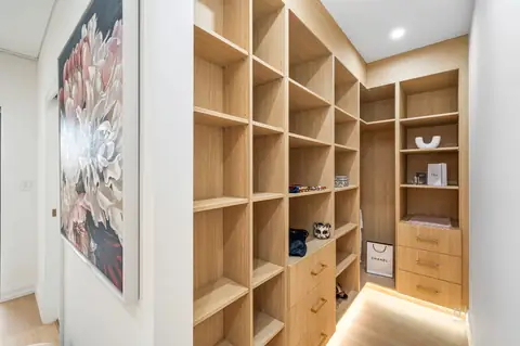 Walk-in wardrobe with open timber shelving and drawers – knockdown rebuild at 28 Aylesbury Crescent, Chipping Norton