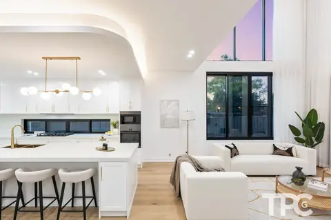 Kitchen island and pendant lights beside the double-height living area – knockdown rebuild at 146 Wattle Road, Sutherland