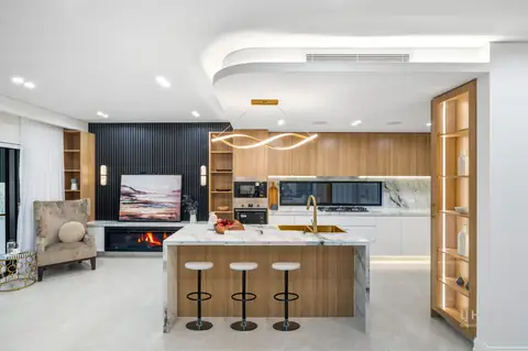 Kitchen with island bench, stone-look benchtops and timber-look joinery – knockdown rebuild at 28 Aylesbury Crescent, Chipping Norton