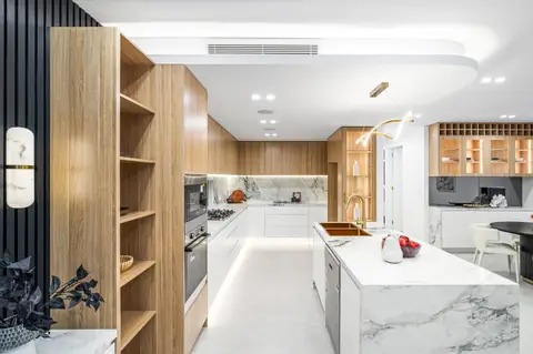 Kitchen with timber-look joinery, marble-look island and display shelving – knockdown rebuild at 28 Aylesbury Crescent, Chipping Norton