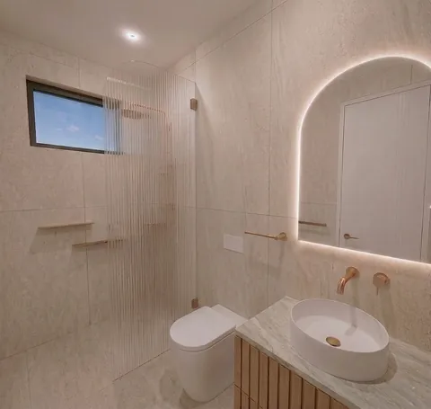 Architectural render: Bathroom with a fluted glass shower screen, backlit arched mirror and timber vanity – duplex in Sylvania
