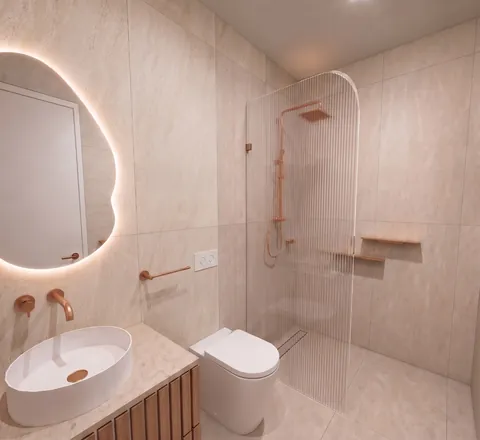 Architectural render: Bathroom with a backlit mirror, fluted glass shower screen and copper-toned tapware – duplex in Sylvania