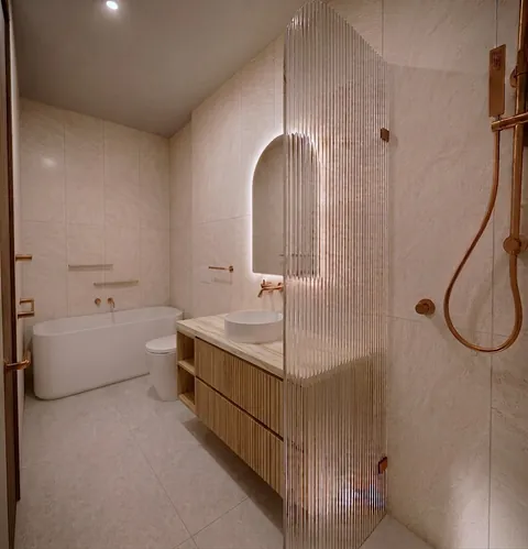 Architectural render: Bathroom with a freestanding bath, fluted glass shower screen and copper-toned tapware – duplex in Sylvania